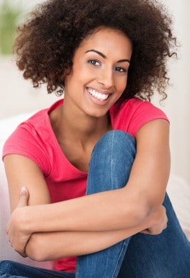 woman smiling after scar removal treatment