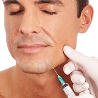 man getting intra lesional cortisone injections in the chin